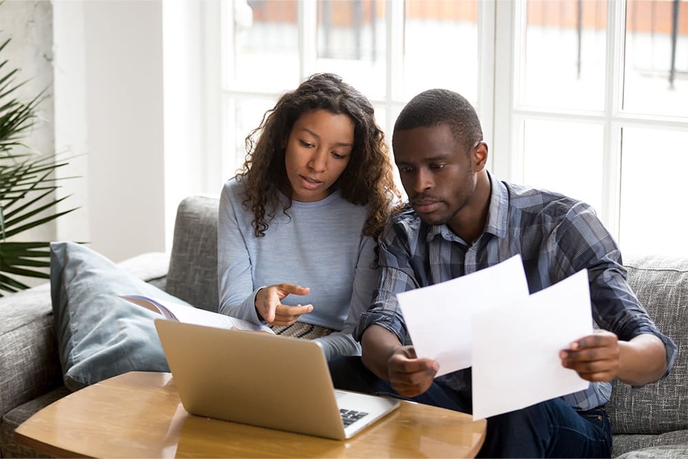 Woman and man looking at a laptop