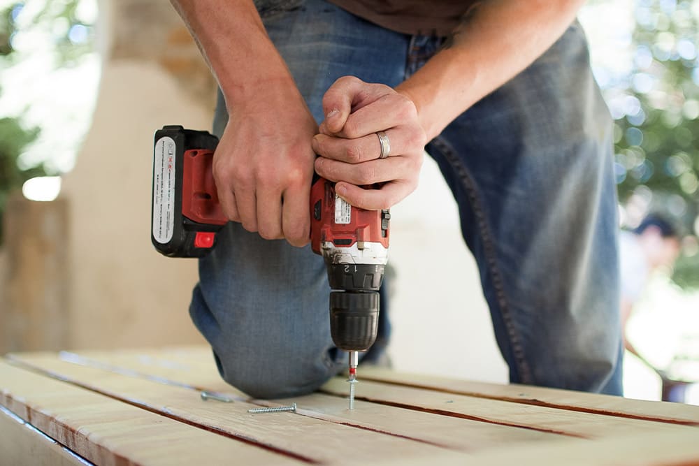 Worker building deck surface
