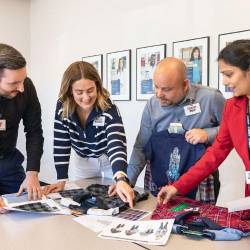 adults looking at products on a table