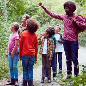 children and adults out in nature