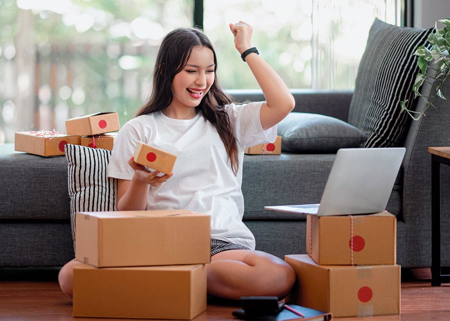 woman sitting by boxes