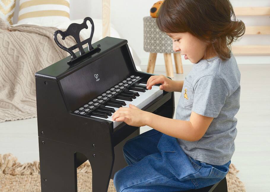 child at a child's piano