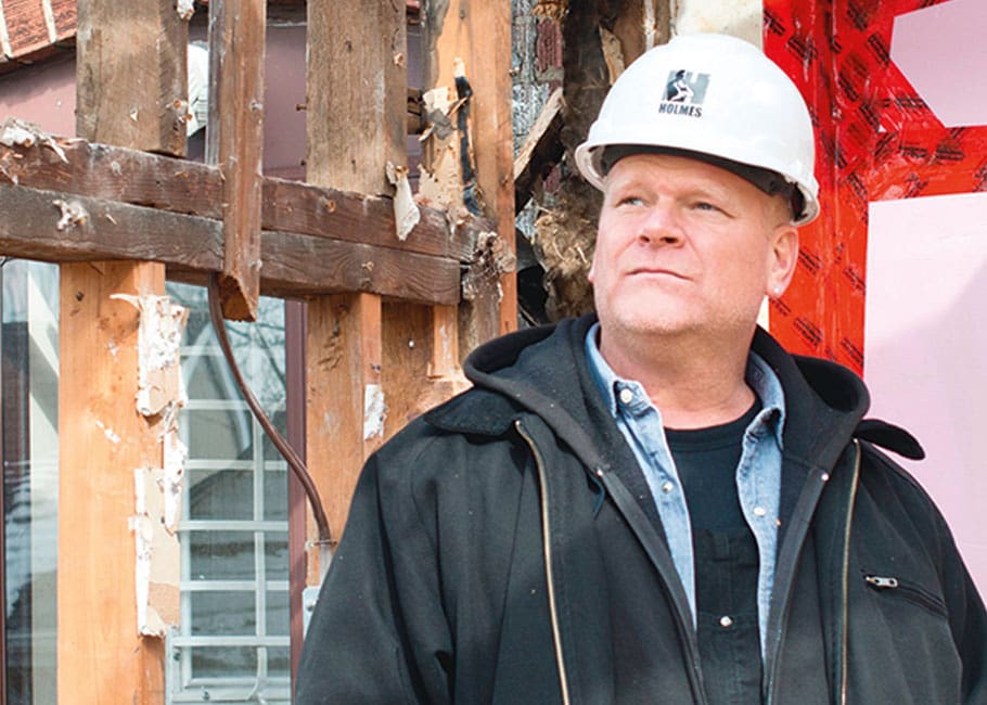 Man in front of home renovation