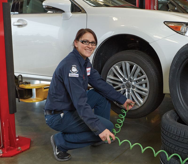 a woman working on tires