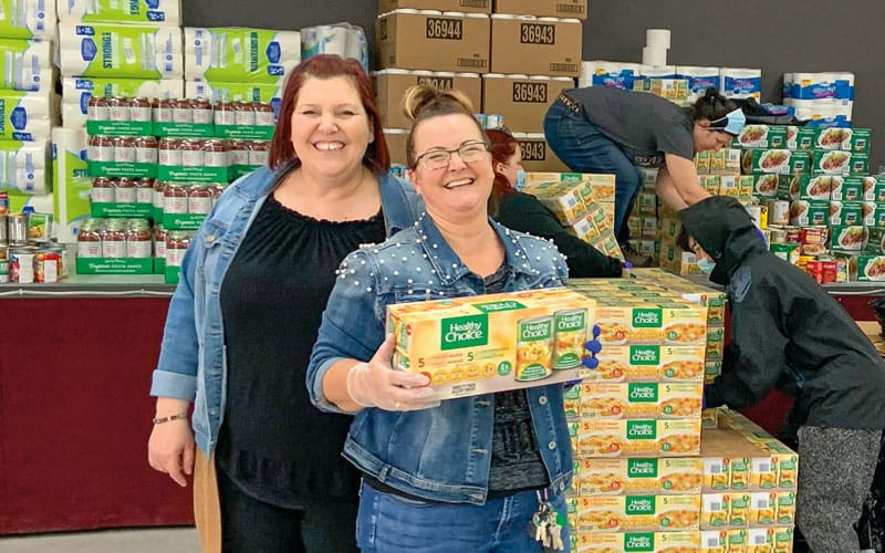 Volunteers from La Maison de la Famille de la Vallée de la Gatineau unload donated food.