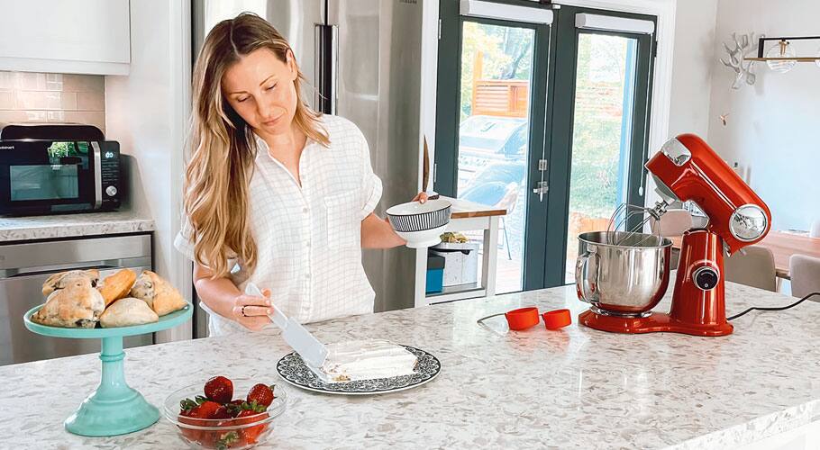 a woman cooking in a kitchen