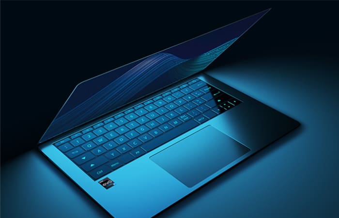 Laptop open in partial clam-shell in a blue hue.