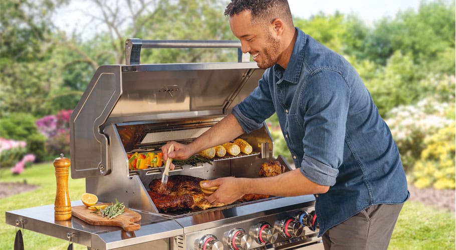 A man cooking at a grill