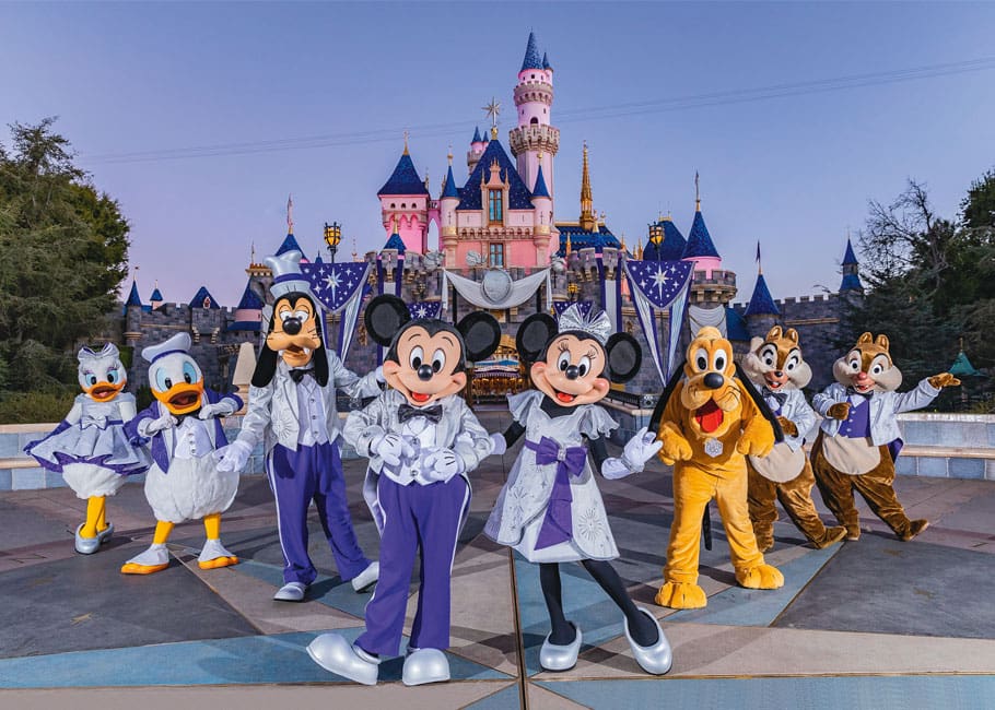 Mickey Mouse and friends in front of Sleeping Beauty's Castle