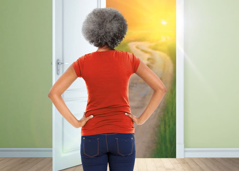 woman looking out a door