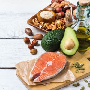 Foods that support a healthy weight like salmon, avocados, etc.
