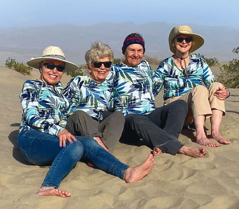 four women on sand