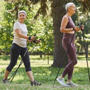 women walking with walking sticks
