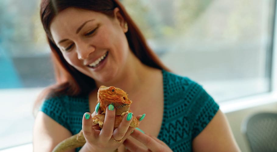 woman and bearded dragon