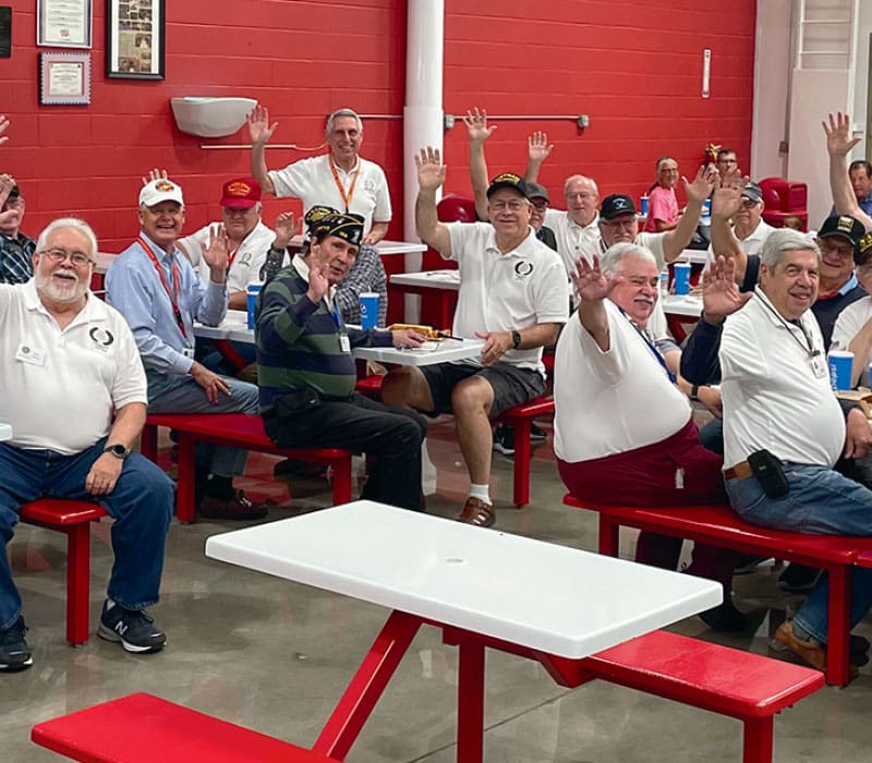 group of men sitting at tables