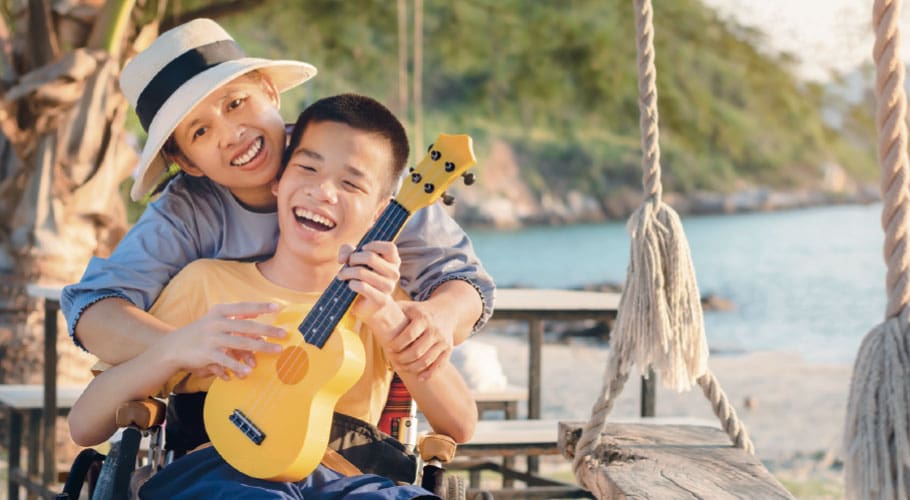 Woman with child playing guitar