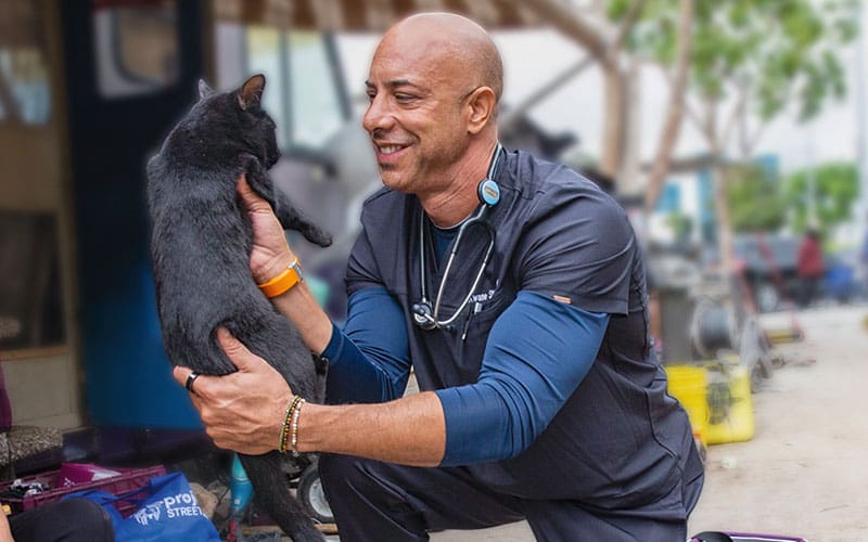 a man holding a puppy