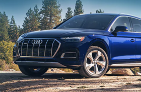 Audi SUV on mountain dirt road